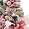 Zasneženo majhno božično drevo okrašeno Rožnato 50cm